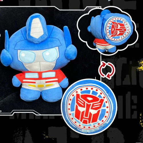 Peluche Optimus Prime bleu et rouge, logo Autobot visible au dos, style cartoon – Transformers.