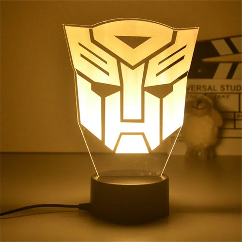 Lampe LED décorative logo Autobot jaune sur socle noir, style moderne, bureau – Transformers.