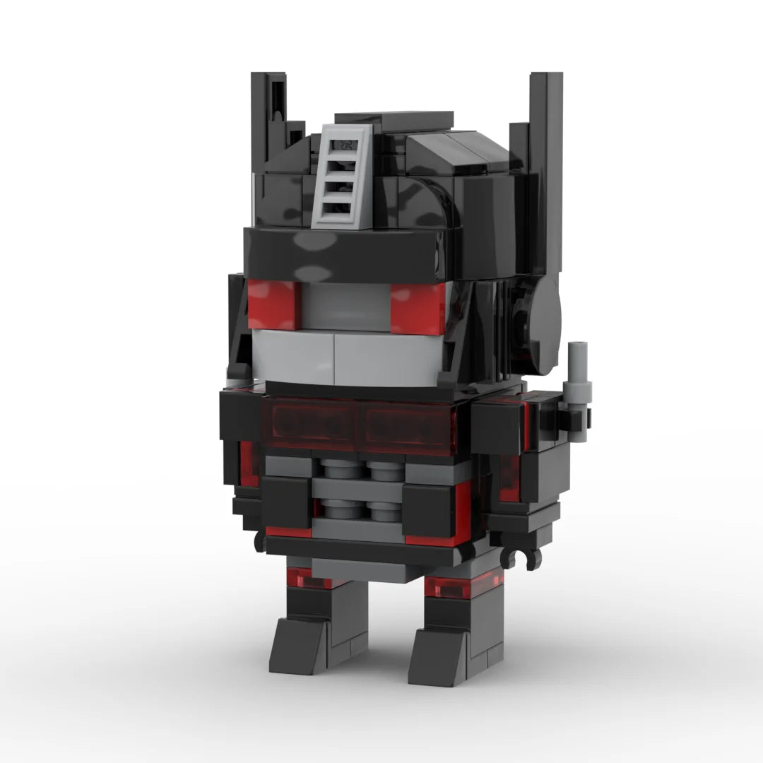 Figurina Transformers StrikerNoir versione IDW — mattoncino antracite, operazioni speciali
