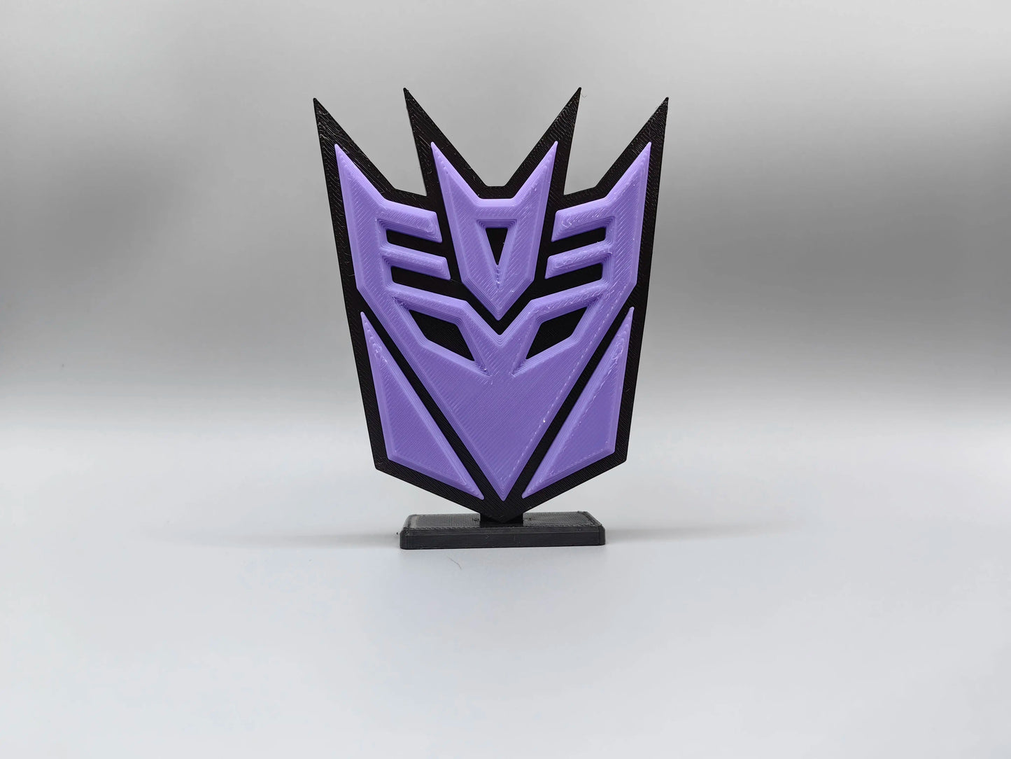Targa Transformers Decepticon viola — Decorazione da scrivania Silhouette dell'emblema