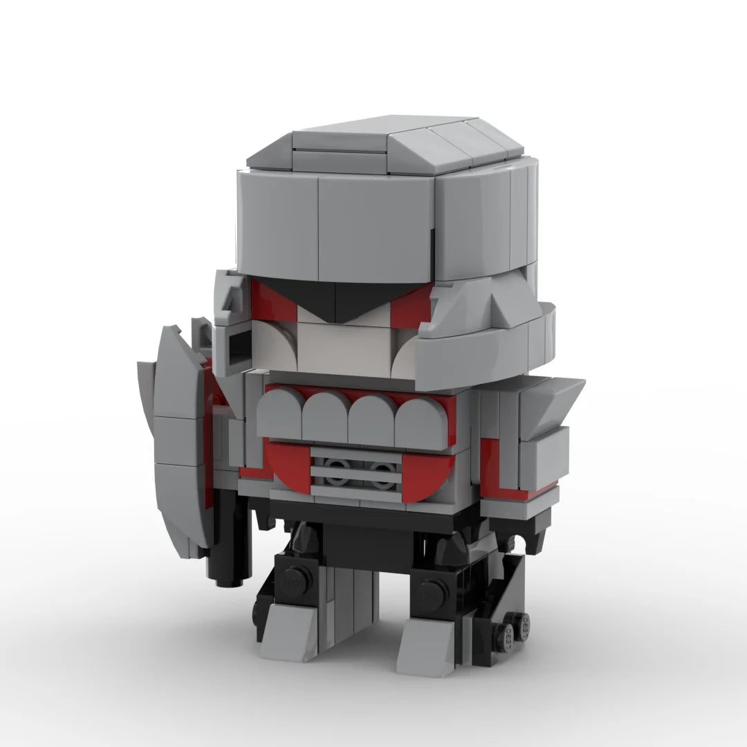 Figurina Transformers Megatron versione IDW chibi — mattoncino grigio e rosso, cannone a fusione