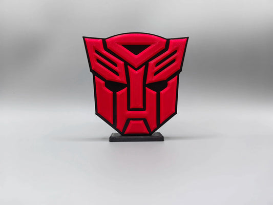 Targa Transformers con logo Autobot rosso intenso — Decorazione da scrivania a forma di scudo massiccio