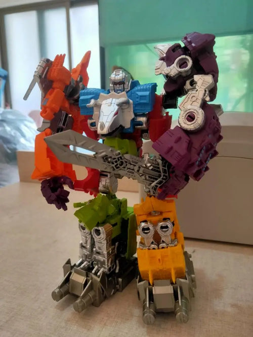 Figurina Transformers Dinoking Photo Réelle — Colorazione rossa e viola senza confezione